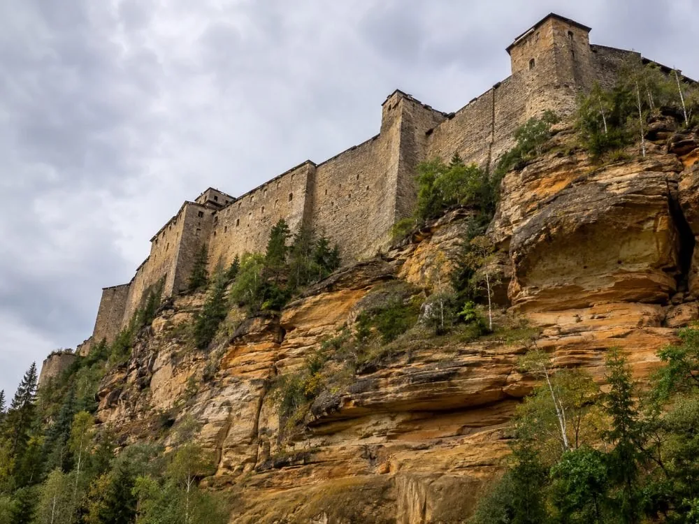 The Torhaus main gate at the top of the ramp, its three-wing sandstone front rising above the approach.